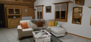 a living room with two chairs and a table at Wohnung in Reichenbach im Kandertal in Reichenbach
