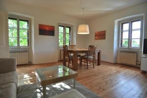 a living room with a table and chairs at Panorama in Aurisina
