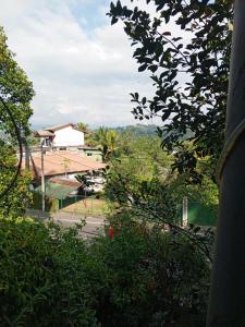 a view of a house from a tree at Kandy Nest Stay Home in Kandy