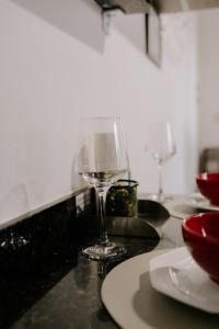 a wine glass sitting on top of a counter at Joia do Pepira in Brotas