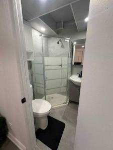 a small bathroom with a toilet and a sink at Lovely apartment for rent in Vitry-sur-Seine