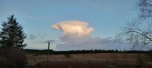 a large cloud in the sky over a field at Foxwell in Ballina