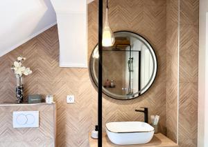 a bathroom with a sink and a mirror at Apartman Romić in Vrlika +27 photos