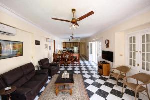a living room with a couch and a table at Paradise Villa - King Mariout in King Mariout