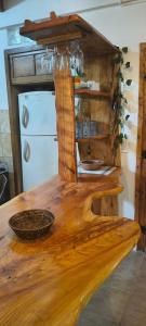 a kitchen with a wooden table with a bowl on it at Paraíso Serrano in Casa Grande