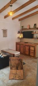 a living room with a couch and a tv at Paraíso Serrano in Casa Grande +9 photos