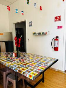 a table with a colorful table cloth on it at Hostel Bemaro Mexico City in Mexico City