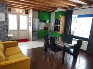 a kitchen and dining room with a table and chairs at Panaghie in Hangul
