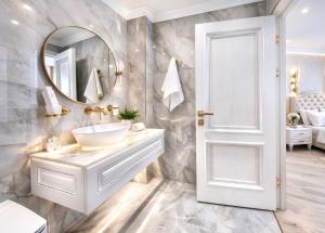 a bathroom with a white sink and a mirror at Yerevan In Boutique Hotel in Yerevan