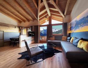 a living room with a couch and a table at Bergsonnhof in Jerzens