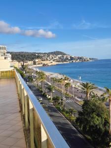 a bridge over a road and a beach at Royal Luxembourg Nice Prom' in Nice