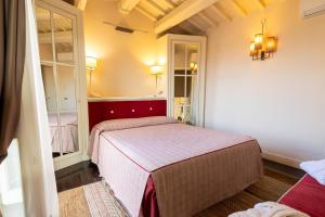 a bedroom with two beds in a room at Hotel Patria in Pistoia