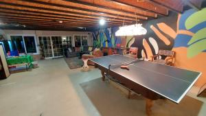 a living room with a ping pong table in it at Country Resort in Bates City