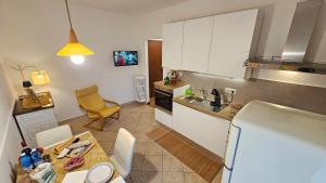 a kitchen with a table and a kitchen with a counter top at Casa Bomba in San Mauro Torinese
