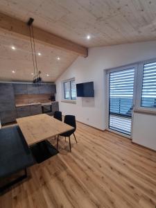 an office with a table and chairs in a room at Ferienwohnung Kogler Zillertal in Fügenberg