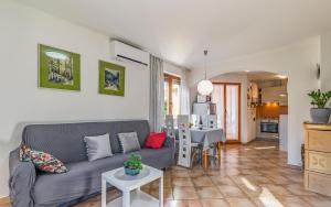 a living room with a couch and a table at Good choice in Valbandon