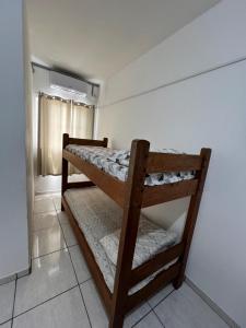 a room with two bunk beds in it at Hotel Santa Thereza in Bofete