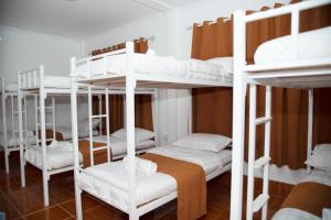 a room with four bunk beds in a room at Sengdao backpacker in Vang Vieng