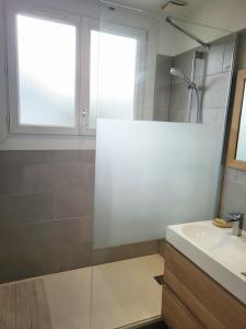 a bathroom with a shower and a sink at Ernest Lodge Angers in Angers +13 photos