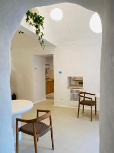 a living room with a table and chairs at Tantillo Cinque in Modica