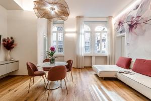 a living room with a couch and a table at Realkasa Kairos Luxury Apartments in Bologna