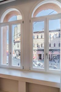 a window with a view of a city at Realkasa Kairos Luxury Apartments in Bologna