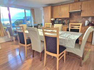 a kitchen and dining room with a table and chairs at Firthview House great for families with children pet friendly in Kirn