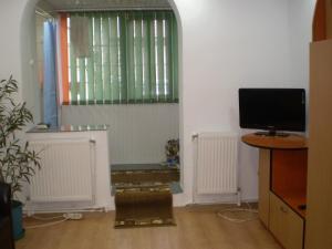 a living room with a television and a window at apartament MIHAI in Mangalia