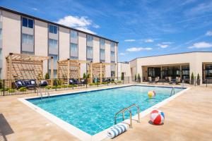 a swimming pool in front of a hotel at Holiday Inn St Louis SW - Route 66 by IHG in Saint Louis