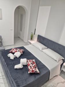 a large bed with two pillows on top of it at Dolce Giò A in Mazara del Vallo +16 photos