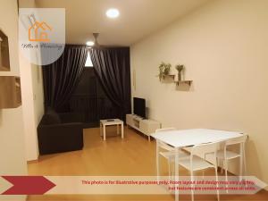 a living room with a white table and a couch at Elevé Gamuda in Banting