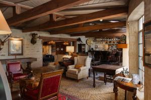 a living room filled with furniture and a table at Joshua Creek Ranch in Boerne