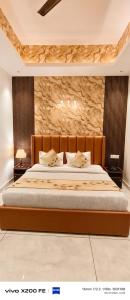 a bedroom with a large bed with two pillows at Hotel Velina in Dhāmpur +75 photos