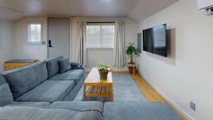 a living room with a couch and a table at Shore Pine Cottage in Grayland