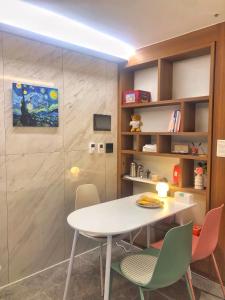 a dining room with a white table and chairs at Cookie House in Seoul