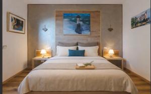 a bedroom with a large bed with two lamps at Trieste Sea Life in Trieste