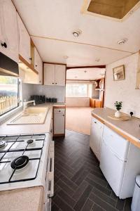 an interior view of a kitchen in an rv at No 26 Mountain View in Cockermouth