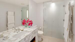 a bathroom with a sink and a toilet and a shower at InterContinental Fiji Golf Resort & Spa by IHG in Natadola +186 photos