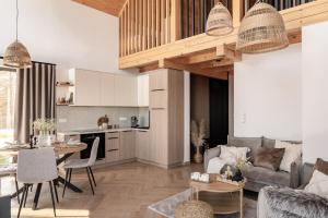 a living room with a couch and a table at Skalne Wzgórze in Ochotnica Dolna