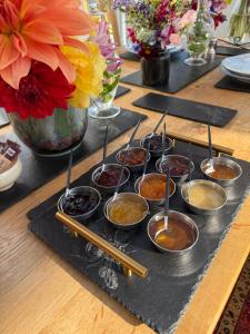 a table topped with bowls of food and chop sticks at Clachan Garden B&B in Garve