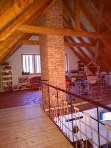 a large room with a brick pillar in a building at WERK 2 - B&B Ecoturistic - Saschiz in Saschiz +40 photos
