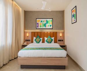 a bedroom with a large bed in a room at The Kalvin Plaza in New Delhi +23 photos