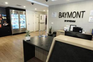 a branch of a bank with a payment counter in a store at Baymont by Wyndham Fort McMurray in Fort McMurray