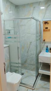 a bathroom with a shower and a sink at The Boutique Hotel Amman in Amman +78 photos