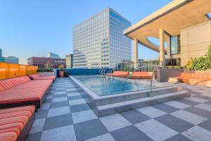 a patio with a hot tub on top of a building at Skyline Sanctuary in Cleveland