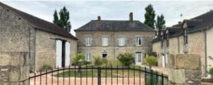 a large building with a gate in front of it at Bed & Breakfast Chateau Saintonge in Le Chevain +12 photos