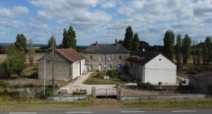 an old house with a gate in front of it at Bed & Breakfast Chateau Saintonge in Le Chevain