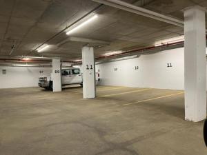 a parking garage with a van parked in it at Baymont by Wyndham Fort McMurray in Fort McMurray