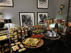a table with many different food items on it at DORMERO Hotel Xanten in Xanten