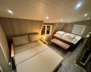 a small room with a couch and a table at TinyHouze in Karlskrona